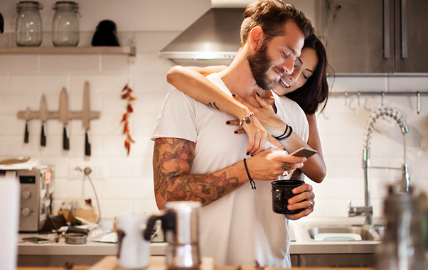 A man and woman Hapily looking at mobile