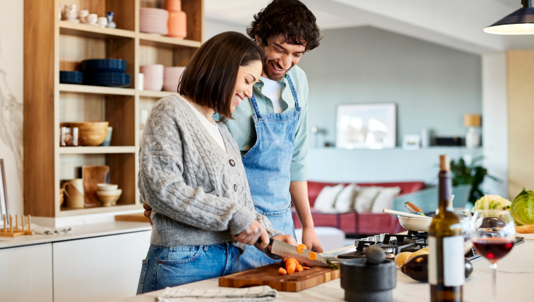 Man and woman prepare healthy food.