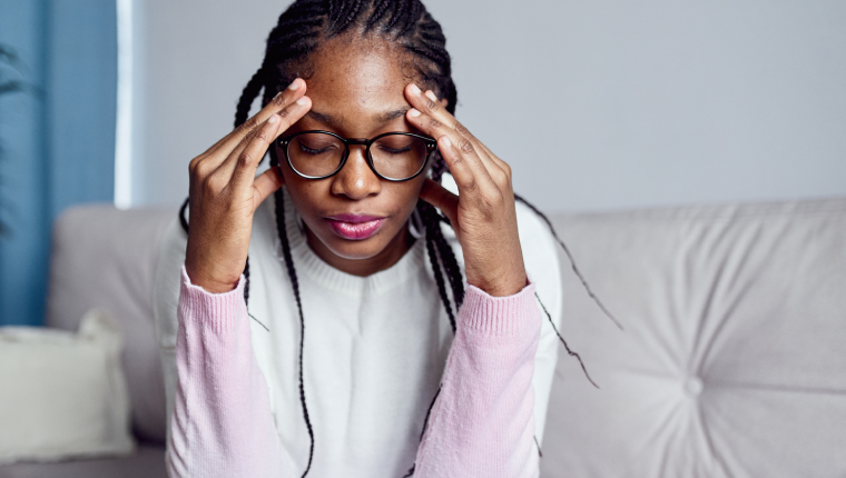 Woman feeling tired due to low iron levels.