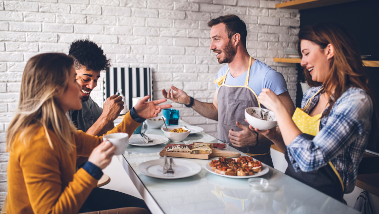 Friends eating meal together.